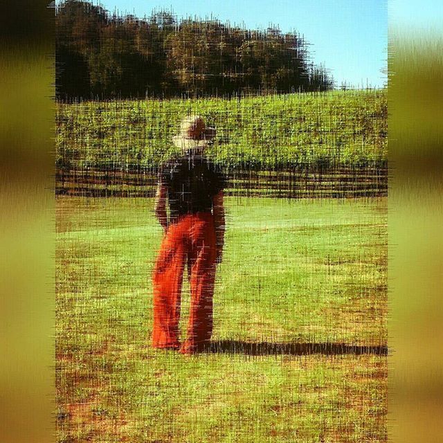 WOMAN STANDING ON FIELD