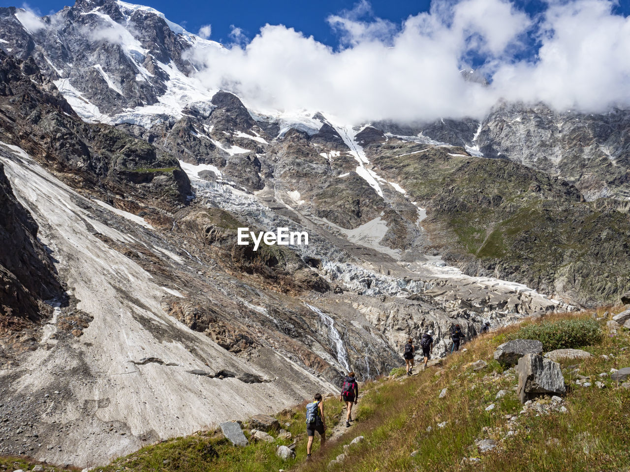 Trekking scene in the italian alps