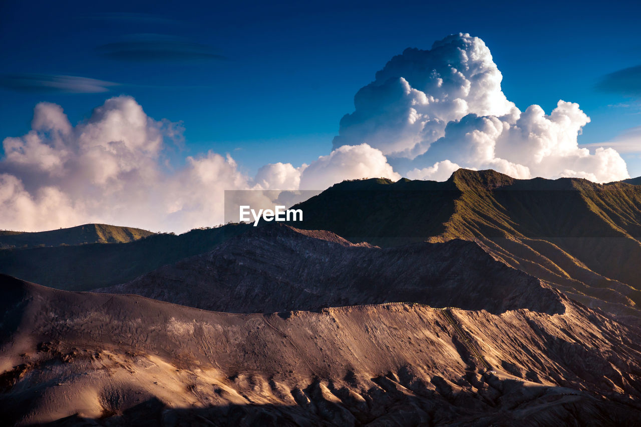 View of mountain range against cloudy sky
