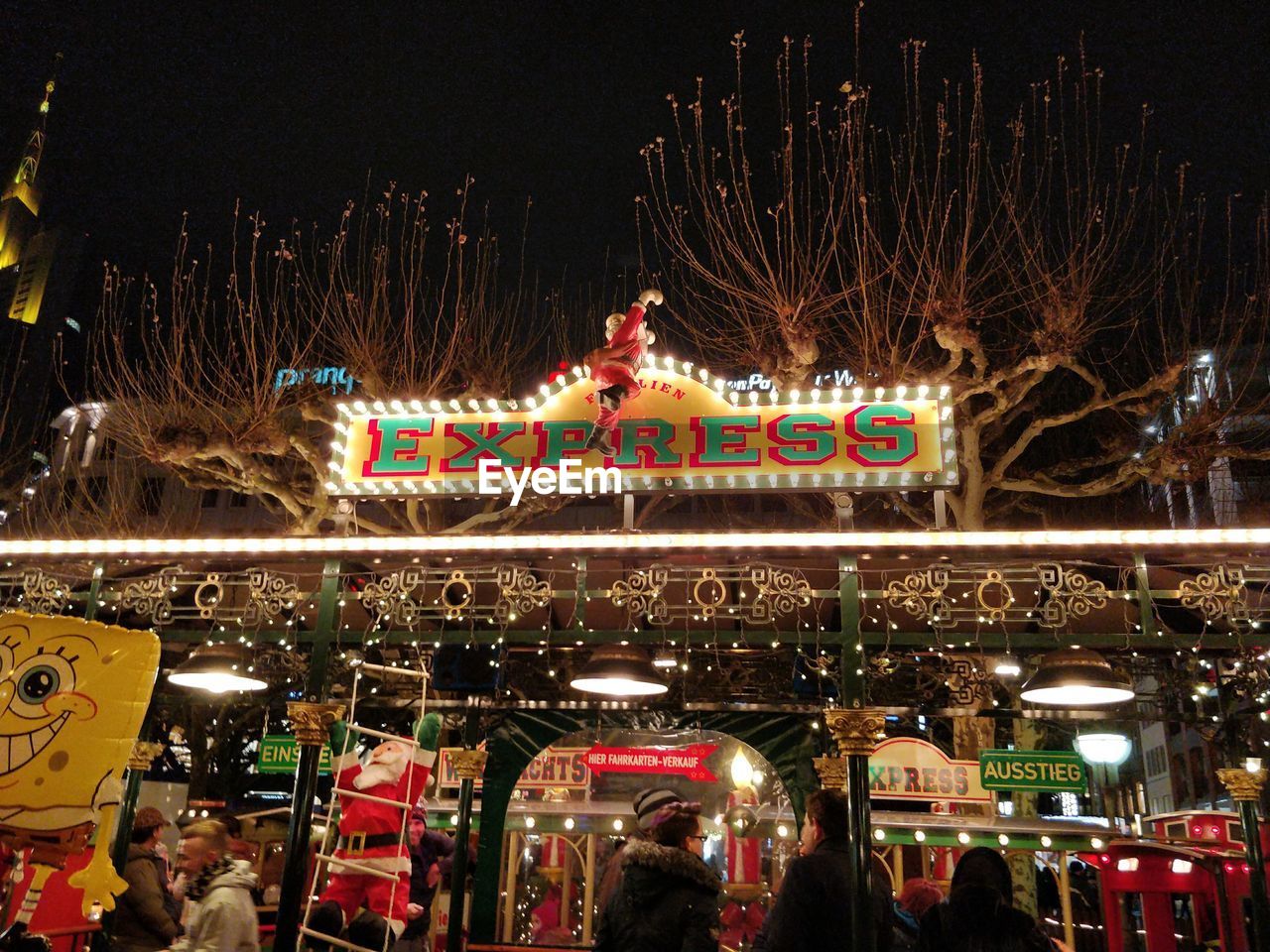 ILLUMINATED CAROUSEL AT AMUSEMENT PARK