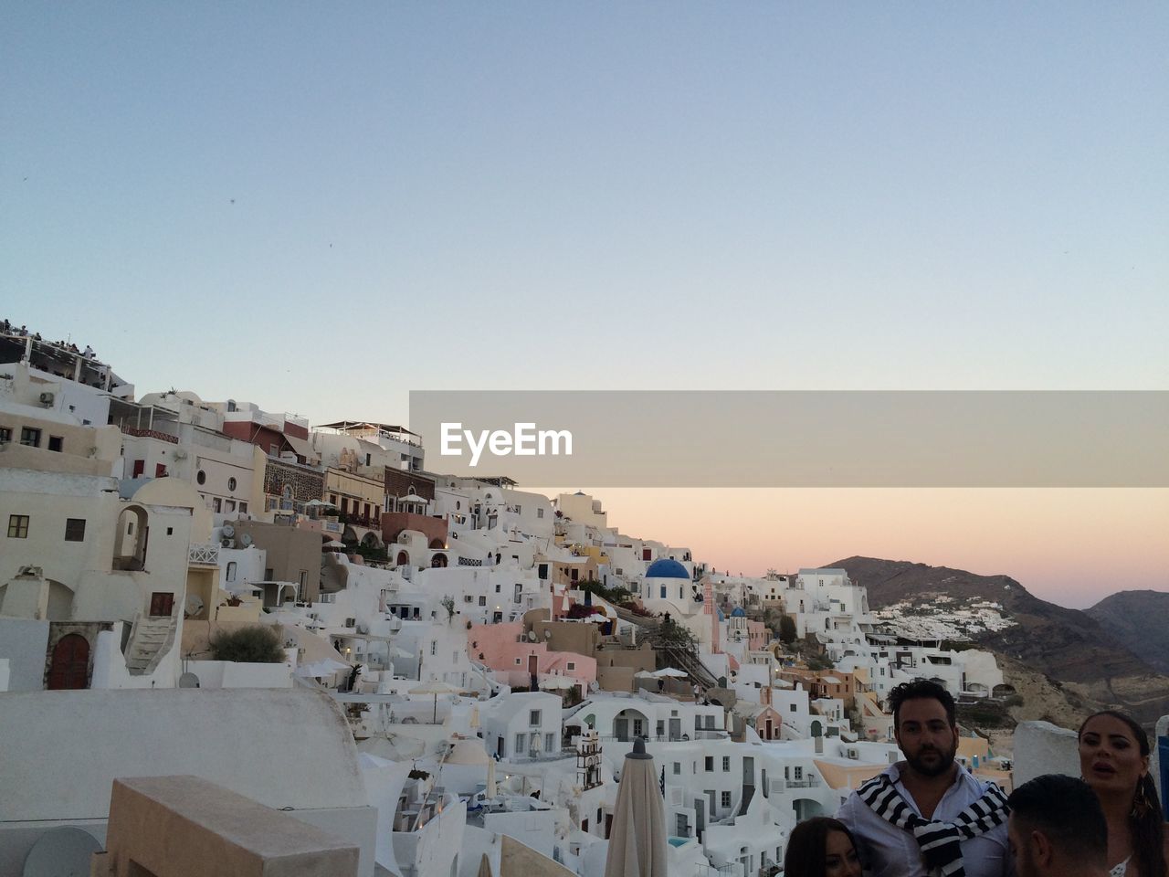 BUILDINGS AGAINST CLEAR SKY