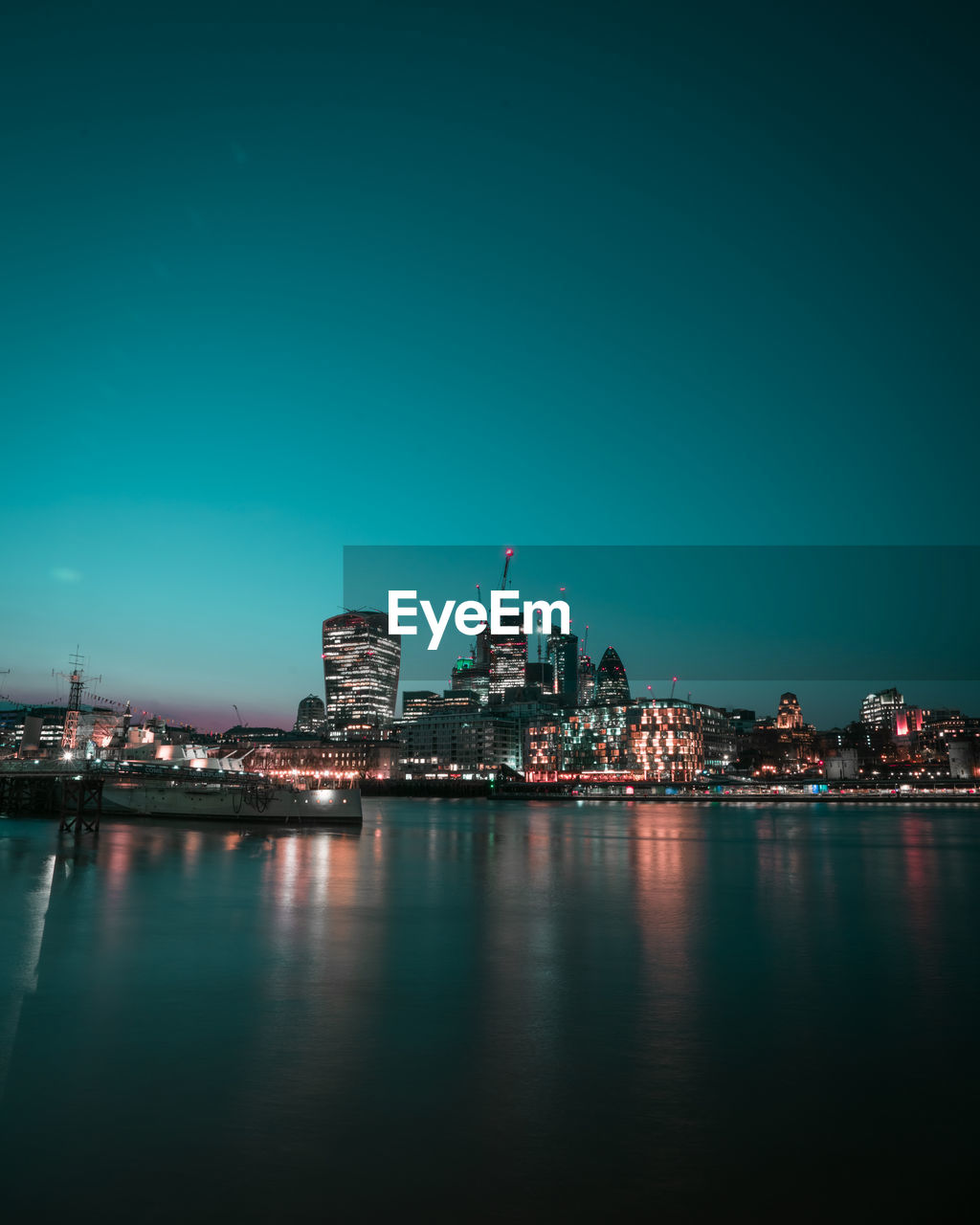 Illuminated buildings in city at night