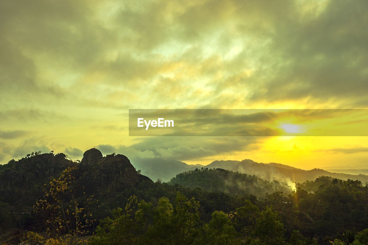 Scenic view of mountains against sky during sunset