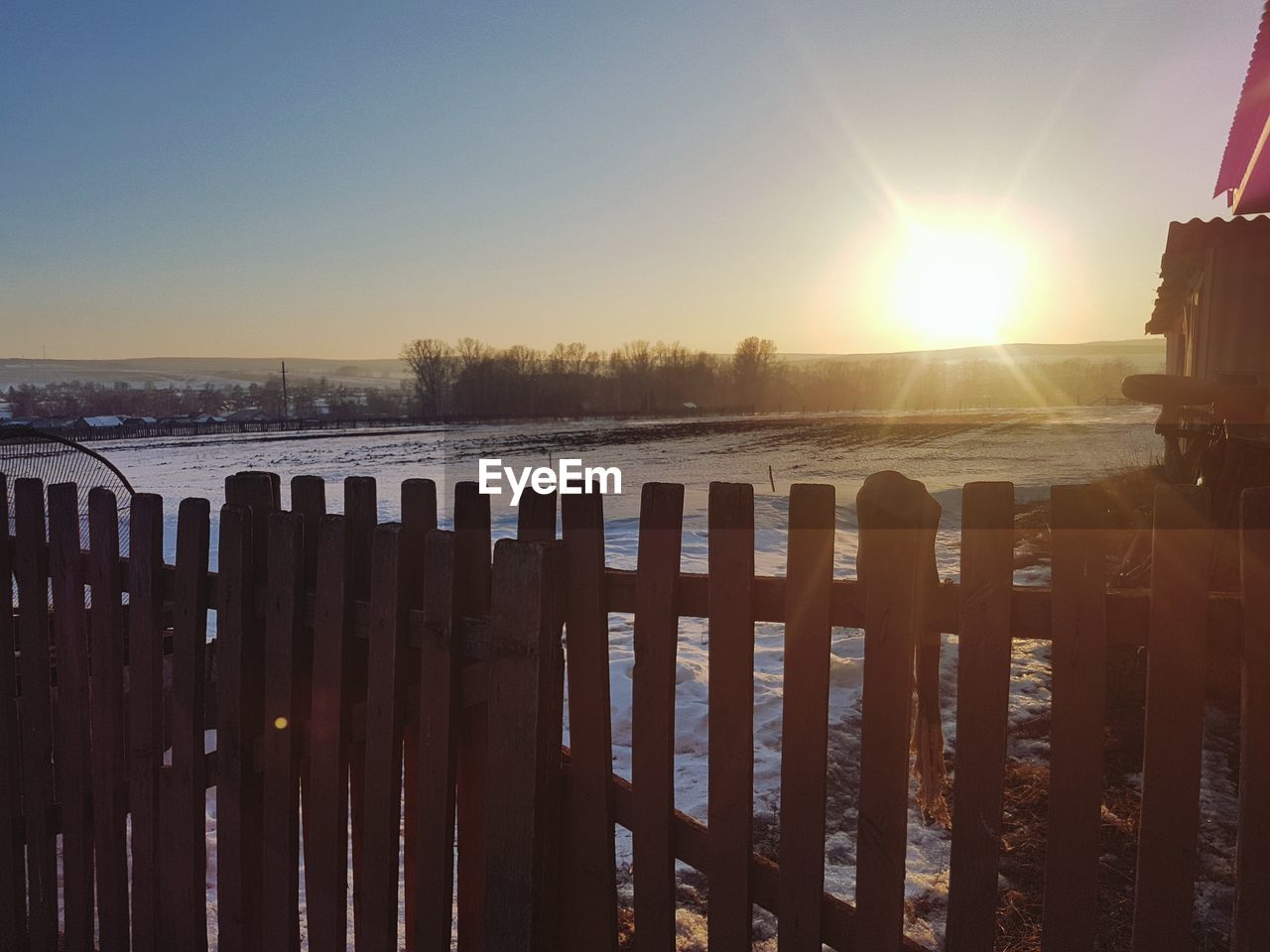 WOODEN POSTS IN SEA DURING WINTER