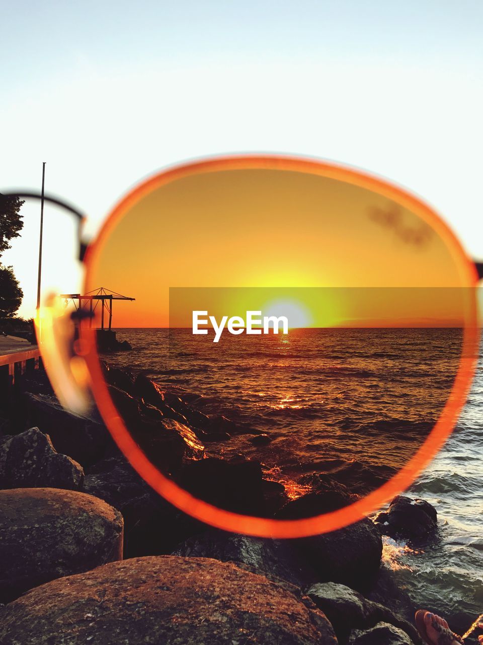 Scenic view of sea through sunglasses