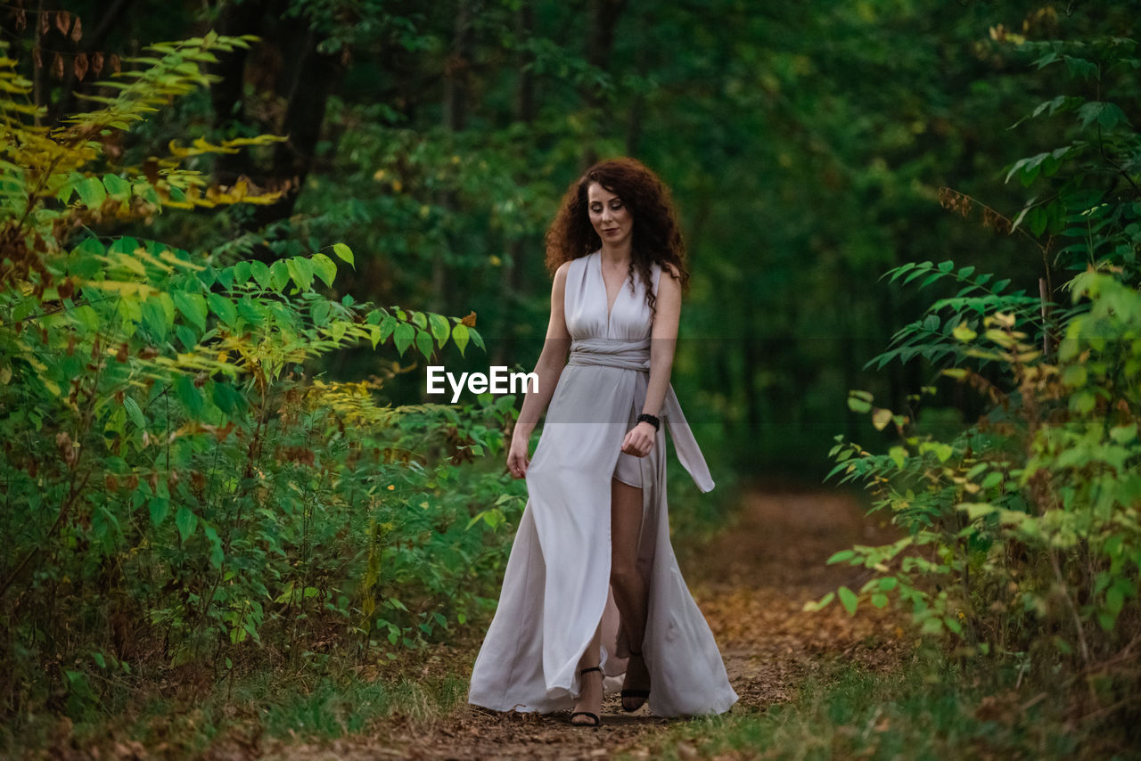 Woman standing in a forest