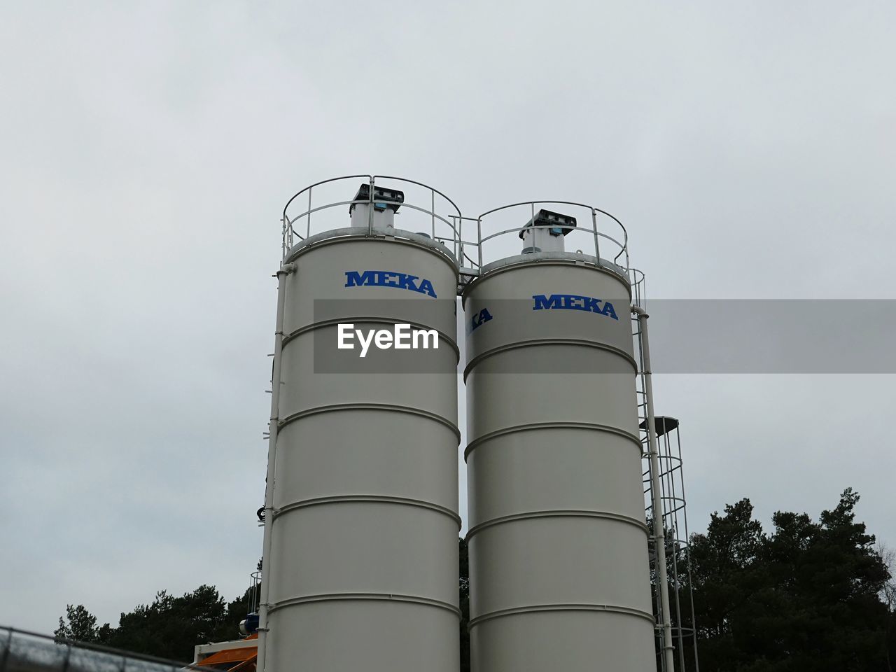 LOW ANGLE VIEW OF FACTORY AGAINST SKY