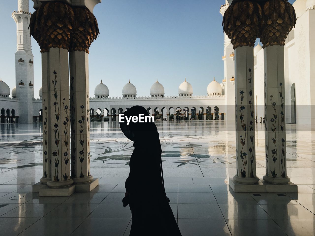 Side view of woman in mosque