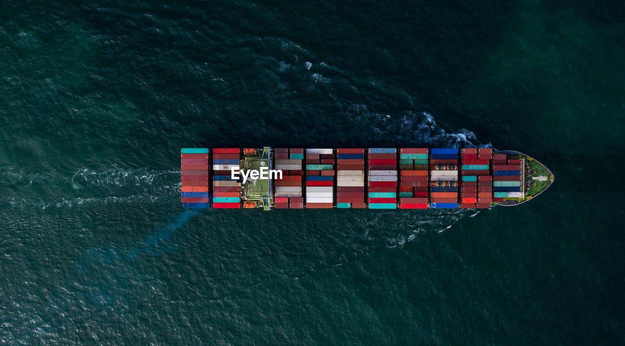 Aerial view container ship in open sea, global business company logistic industry commerce