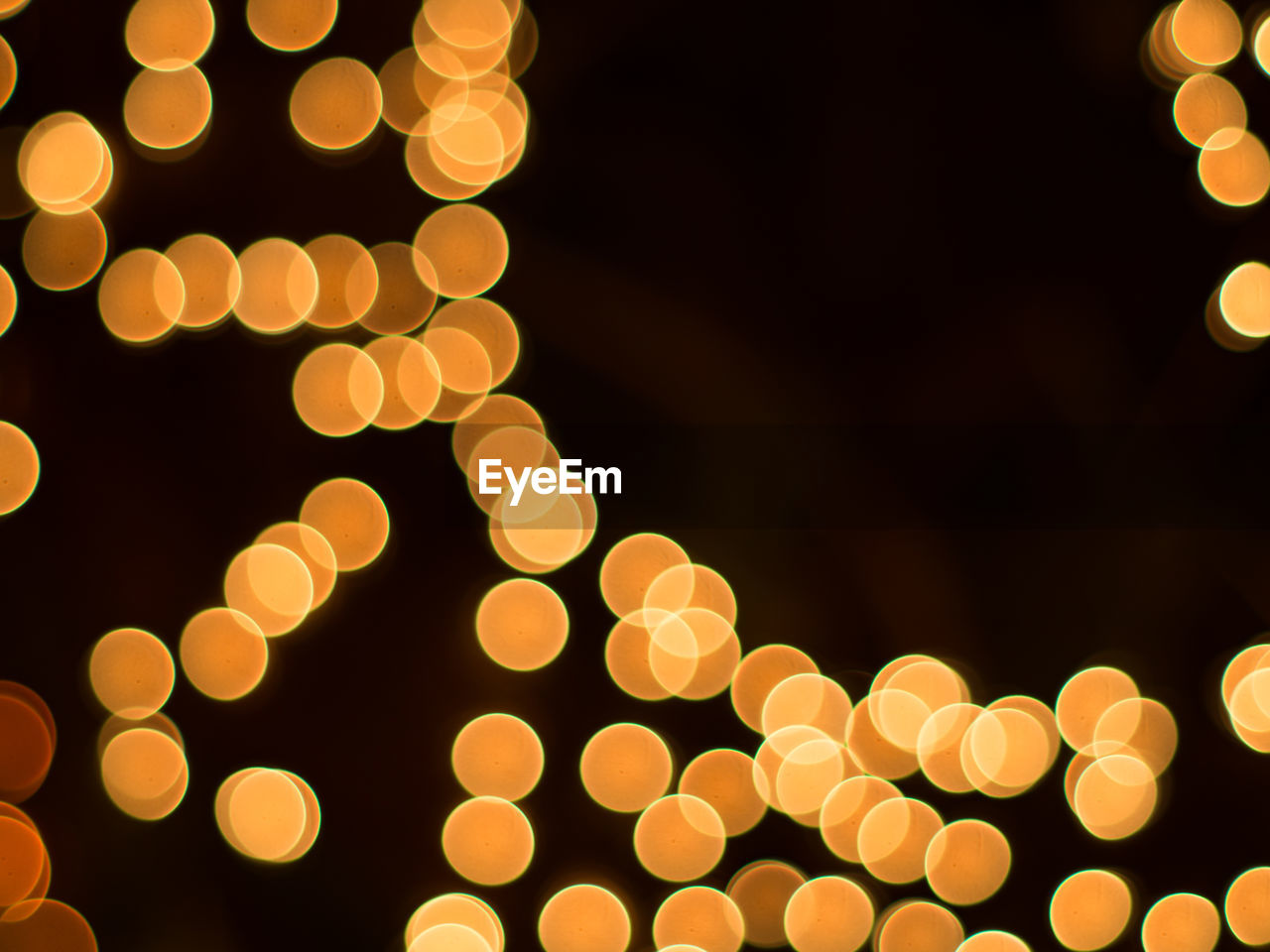 Defocused image of illuminated lights at night