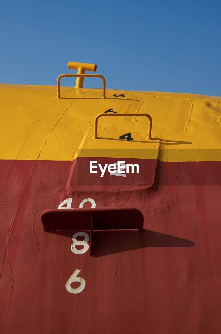 Close-up of painted submarine against clear sky