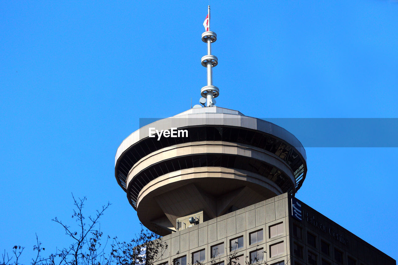 LOW ANGLE VIEW OF BUILT STRUCTURE AGAINST BLUE SKY