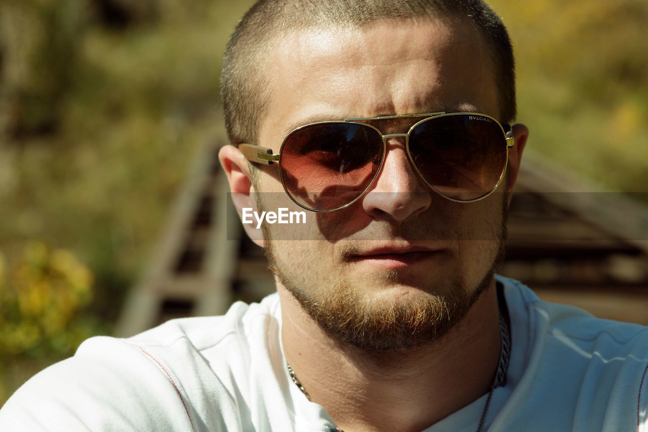 Close-up of young man wearing sunglasses