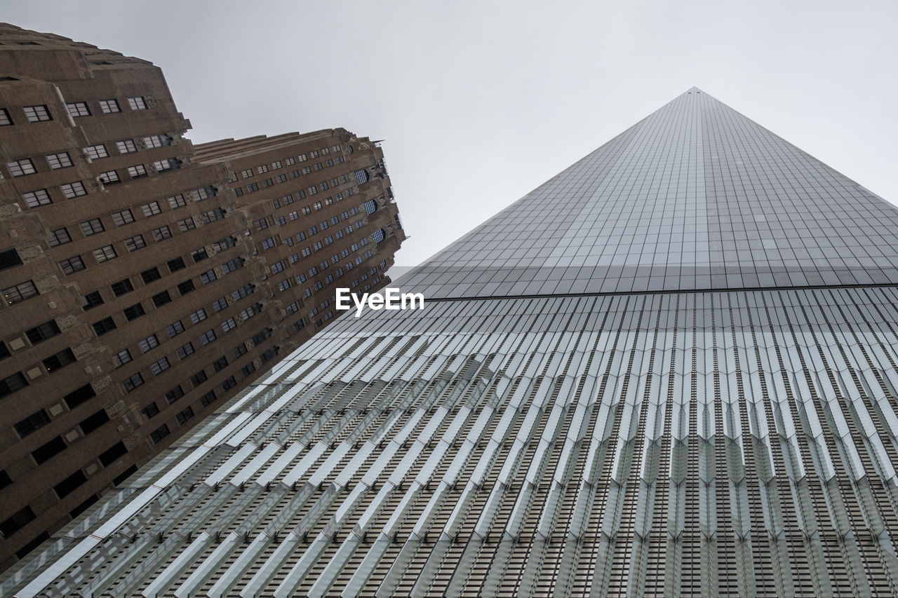 LOW ANGLE VIEW OF MODERN BUILDINGS AGAINST SKY