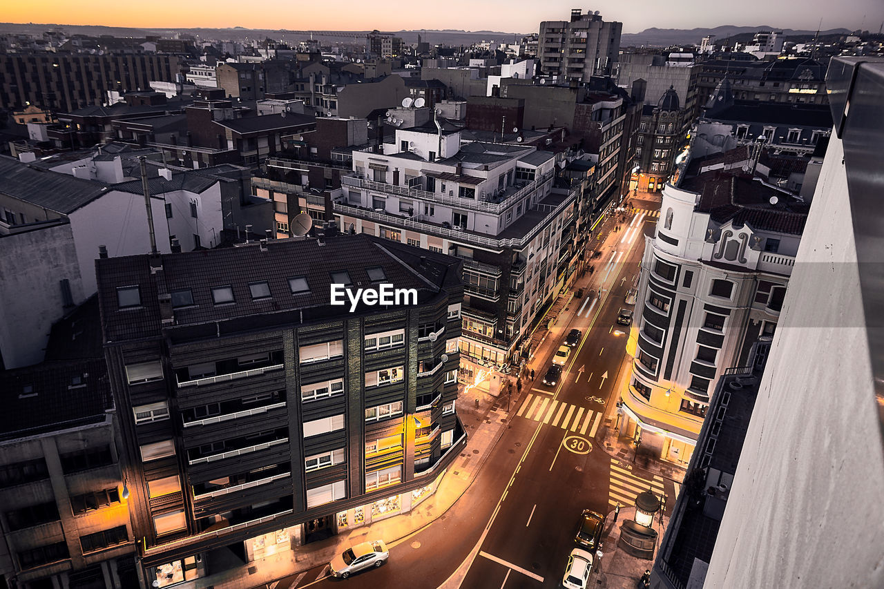 High angle view of illuminated cityscape against sky