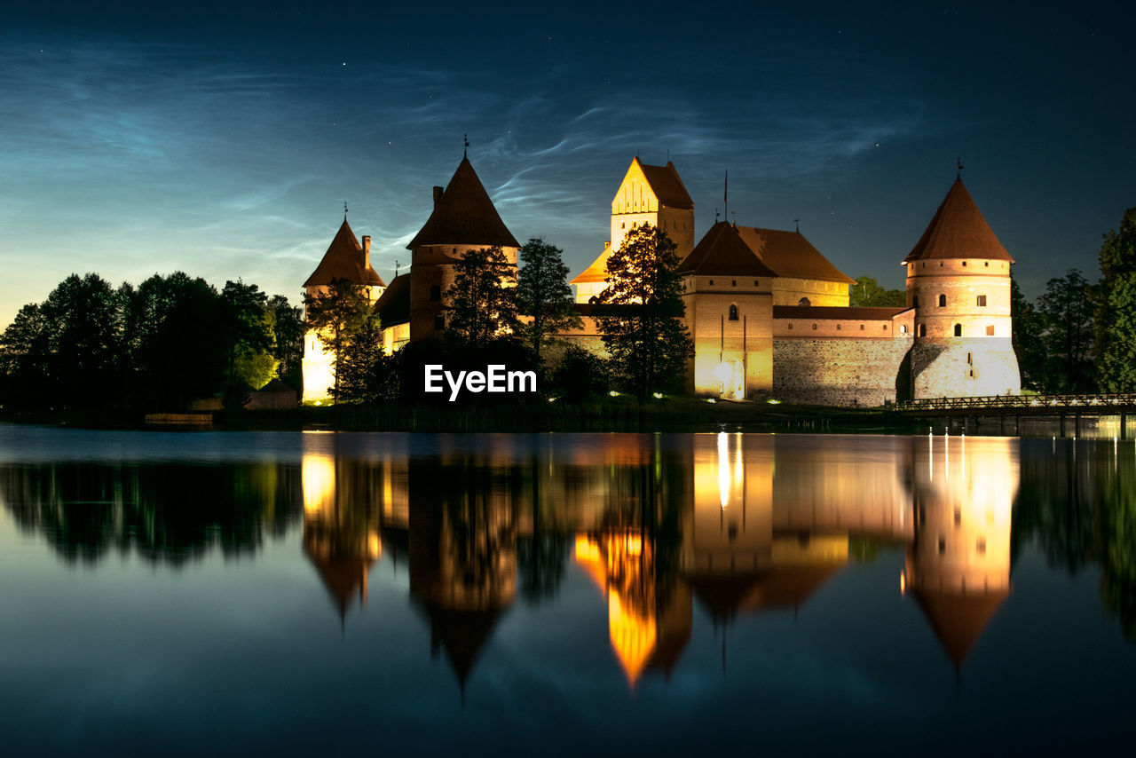 REFLECTION OF ILLUMINATED BUILDINGS IN LAKE