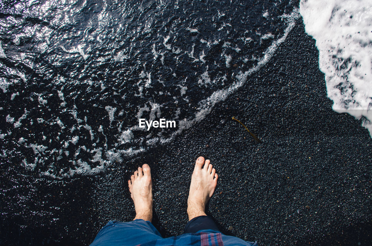 Low section of man at beach