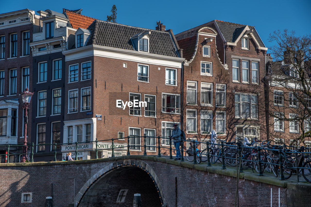 Amsterdam, netherlands, april 2022. the historic canals and bridges of amsterdam.