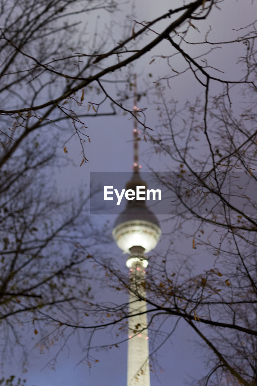 LOW ANGLE VIEW OF ILLUMINATED TOWER AGAINST SKY