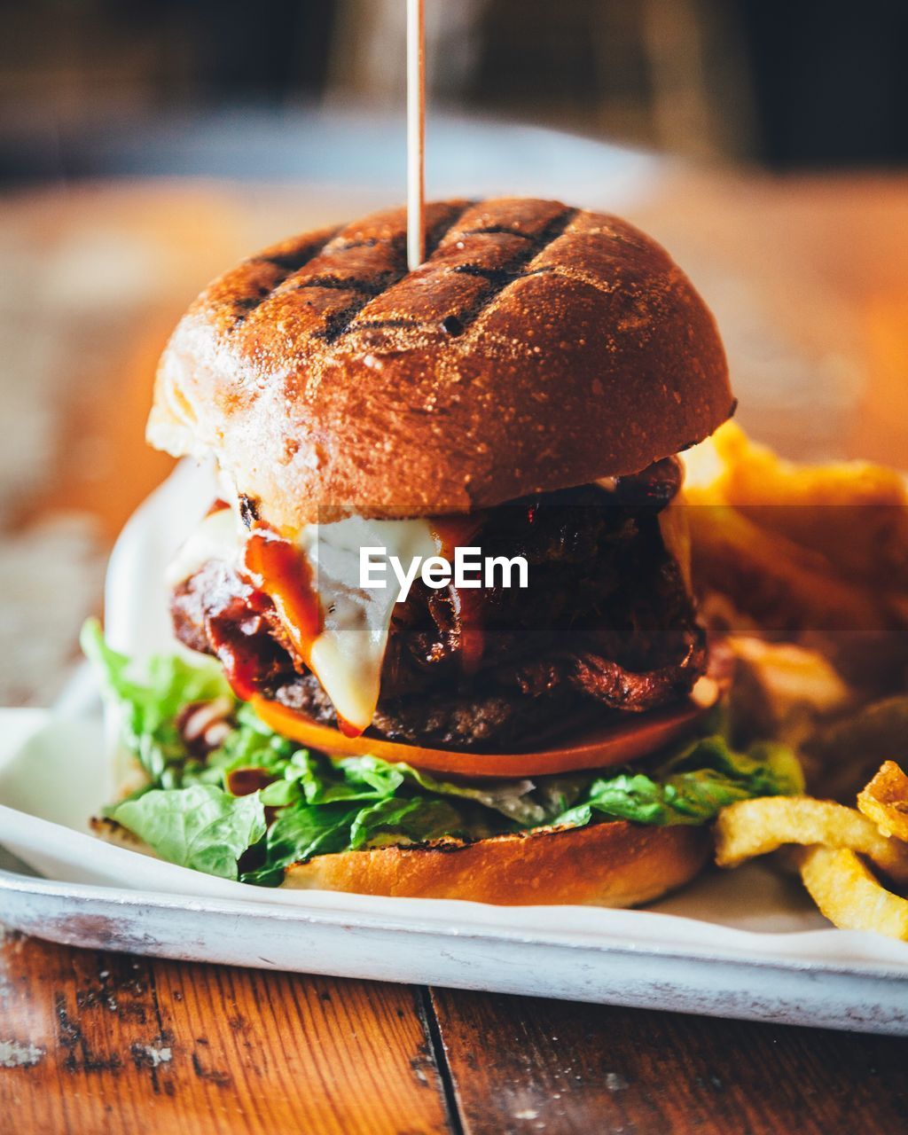 Close-up of hamburger in plate on table