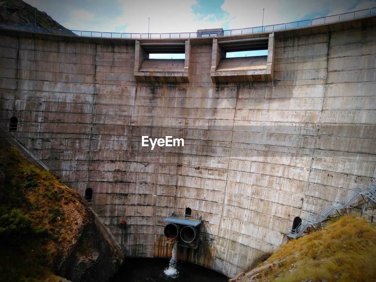 Low angle view of water reservoir wall