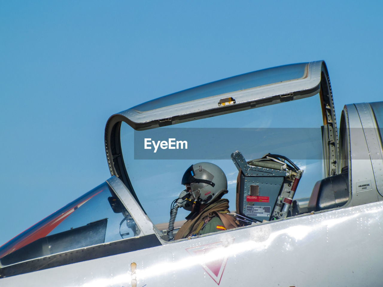 CLOSE-UP OF VEHICLE AGAINST BLUE SKY