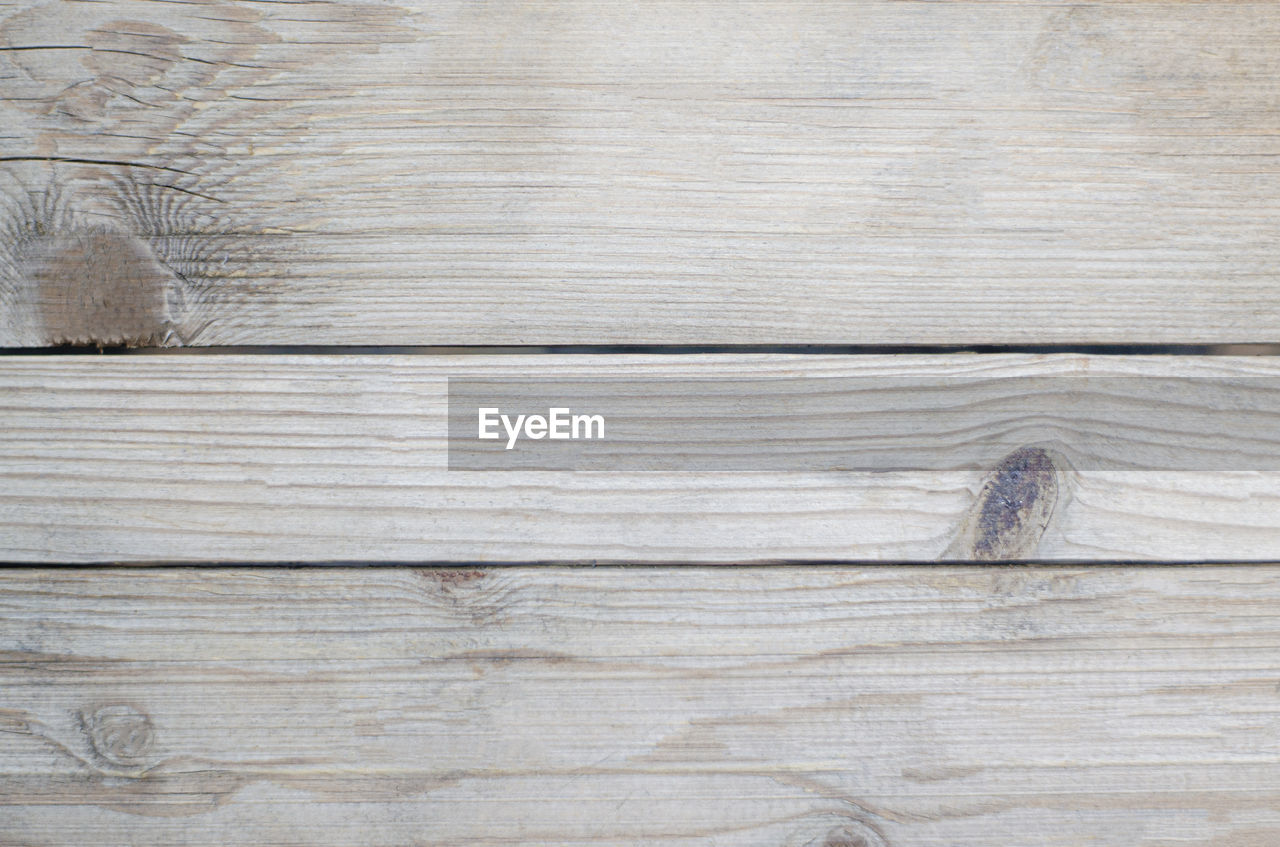 Soft brown wood texture and background. the wooden planks have a soft pattern.