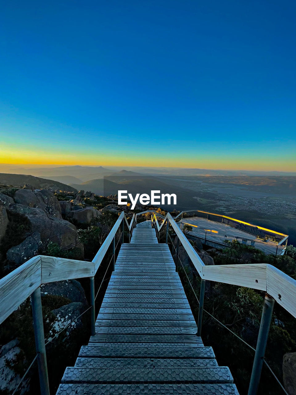 Scenic view of bridge against clear blue sky