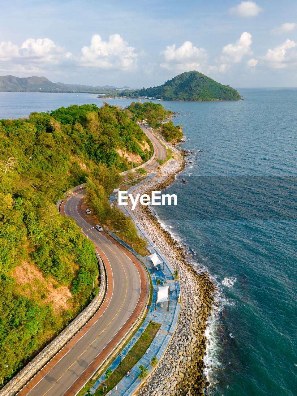 high angle view of city by sea against sky