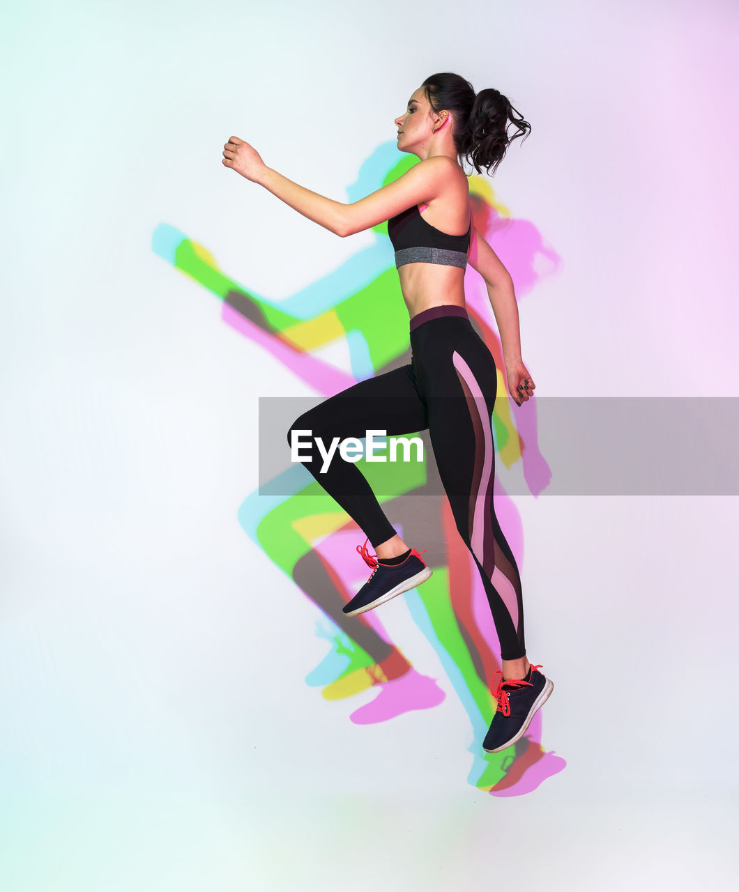 Attractive woman doing stretching exercise or yoga moves with glitch duotone effect