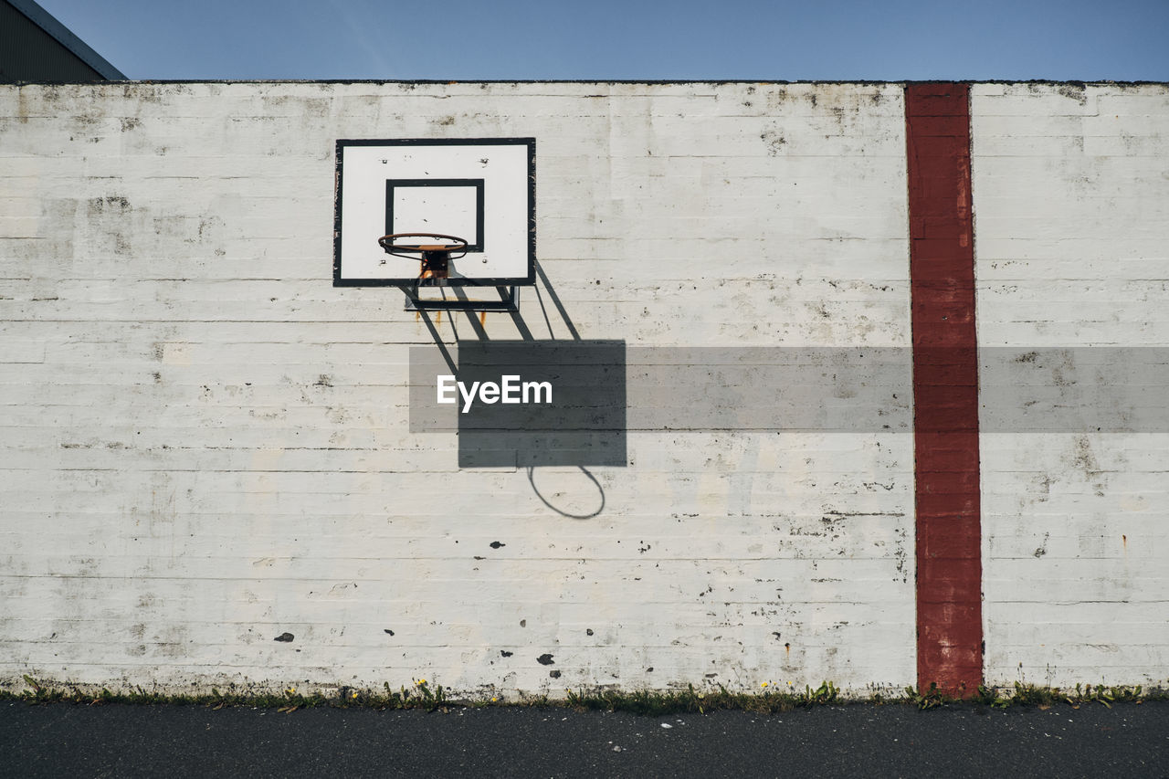 Low angle view of basketball hoop on sunny day