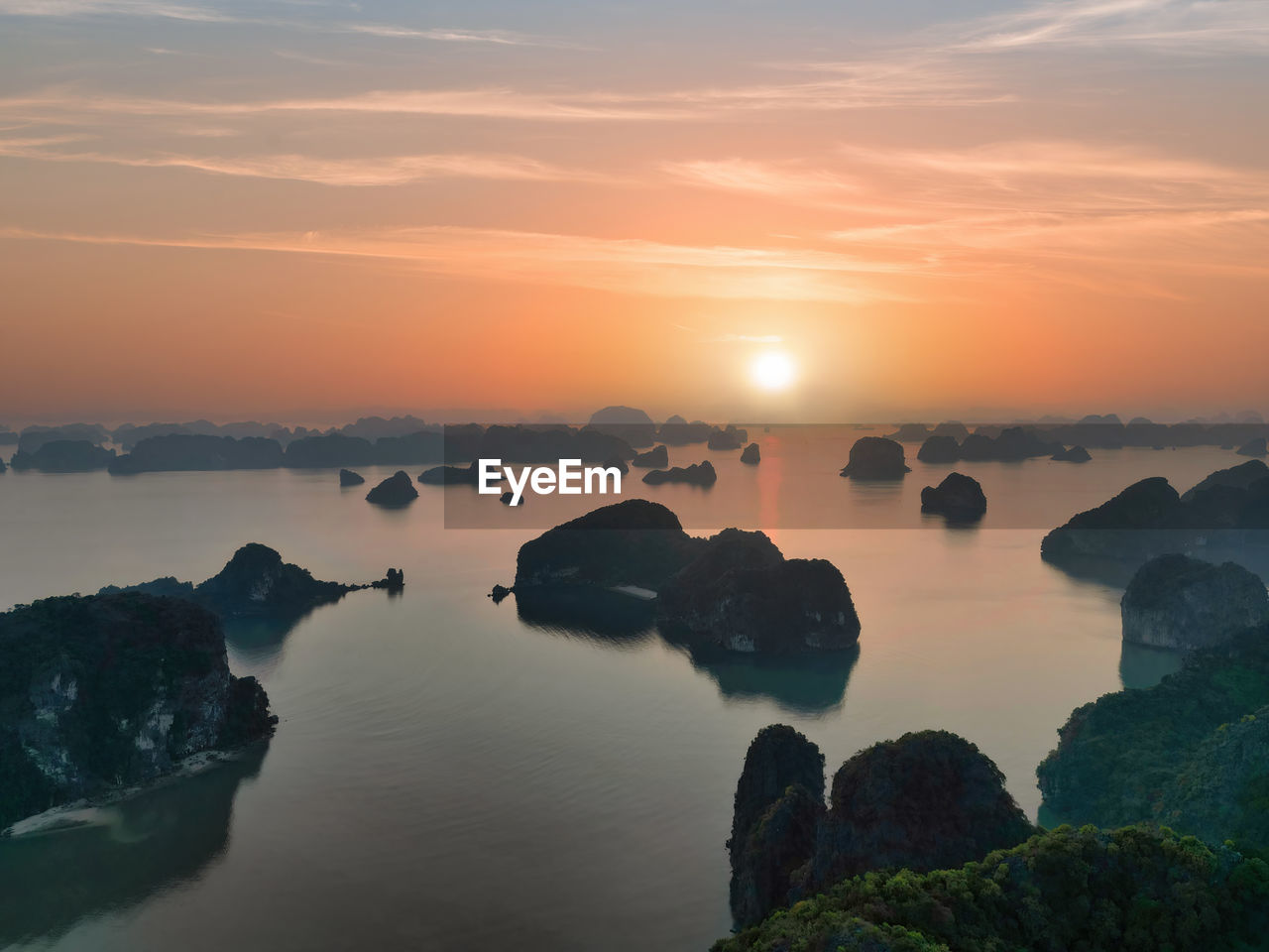 Stunning sunset of halong bay, bai tu long bay in vietnam