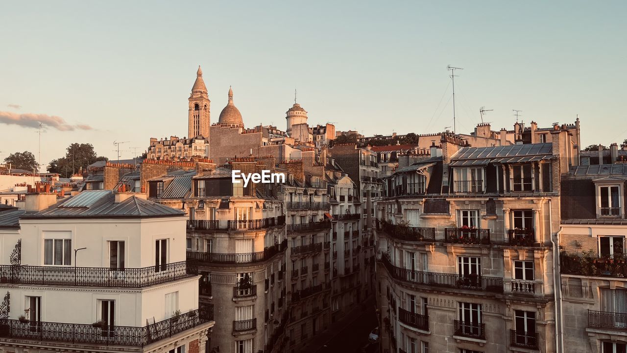 buildings in city against sky