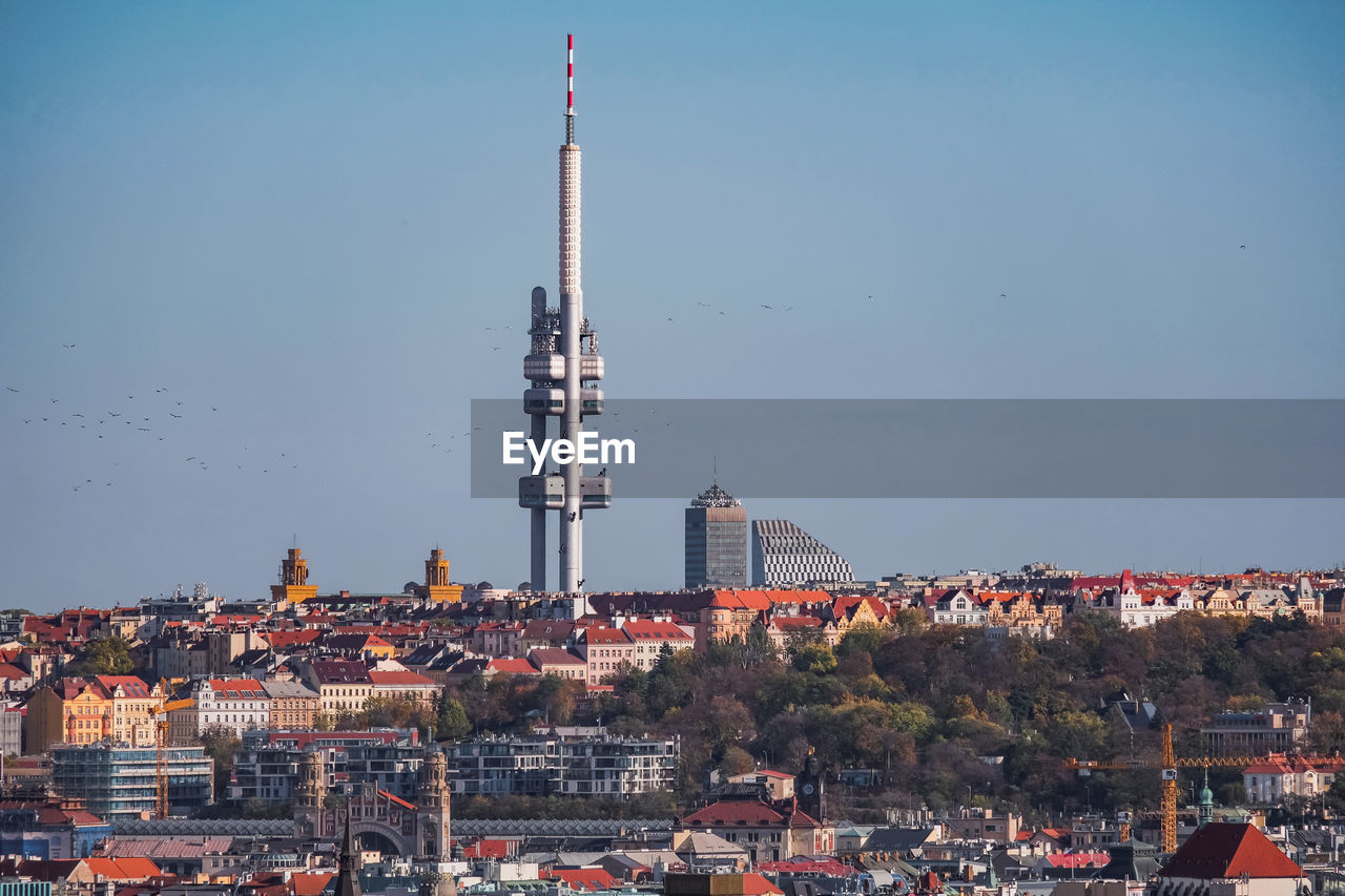 Communications tower in prague against sky