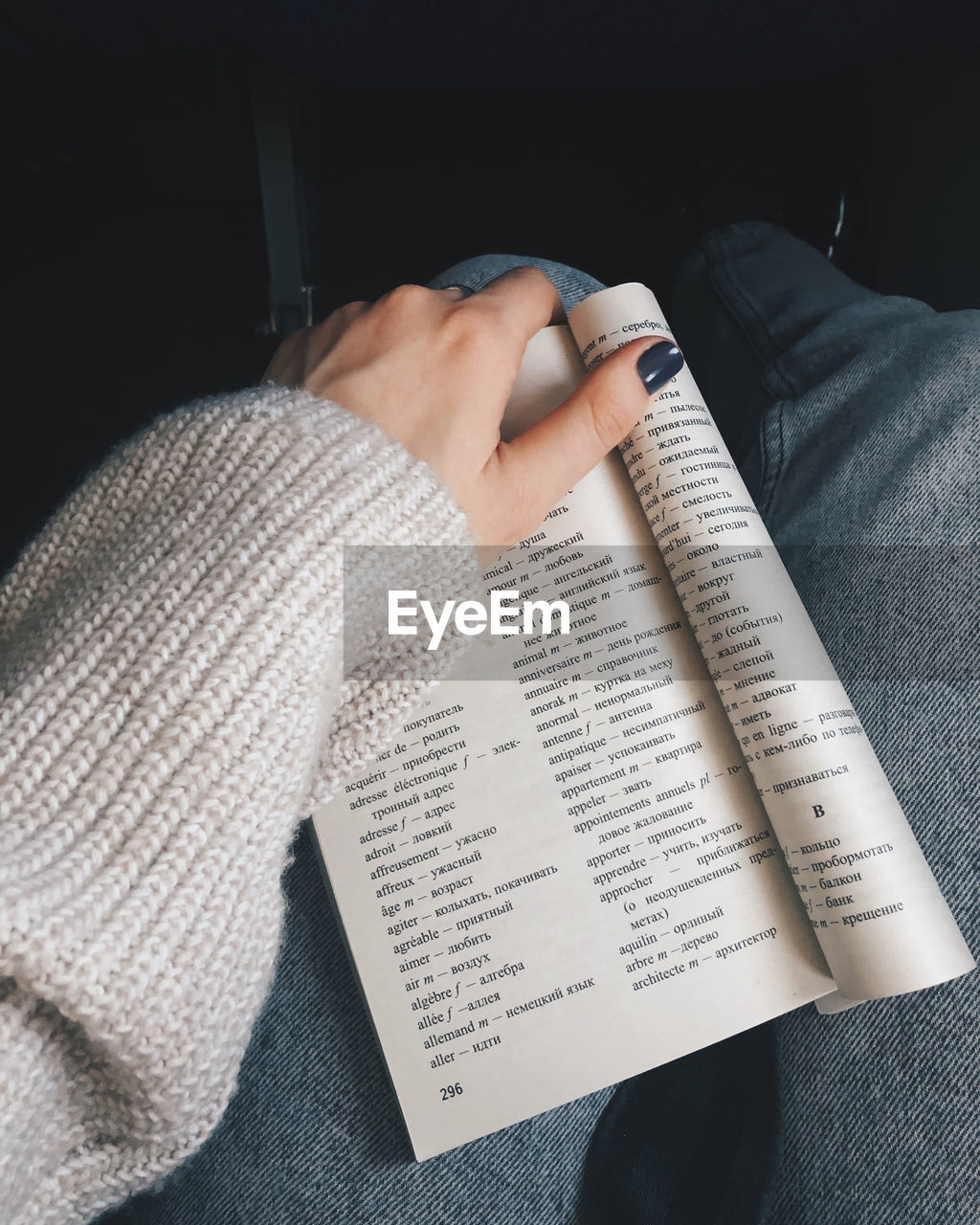 High angle view of woman reading book