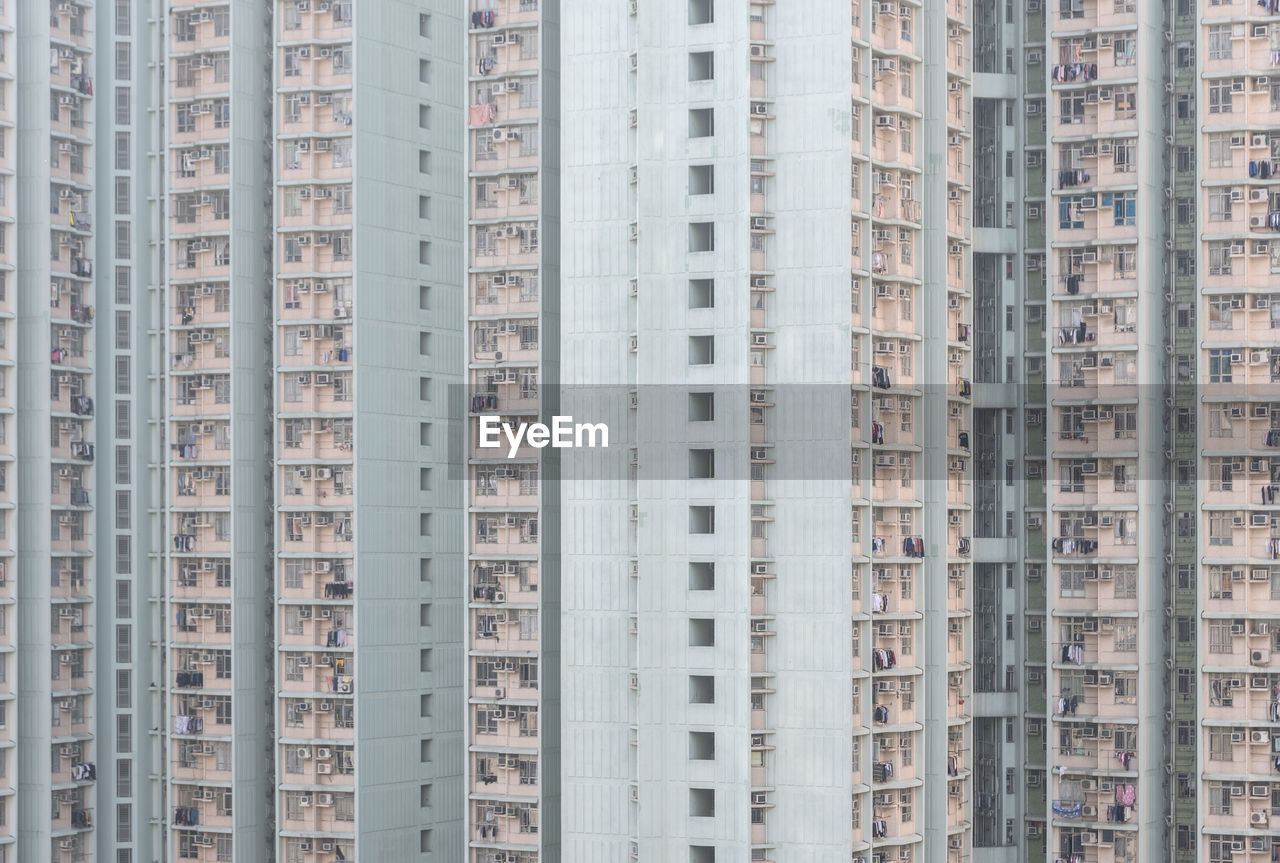 Low angle view of illuminated buildings against sky in city