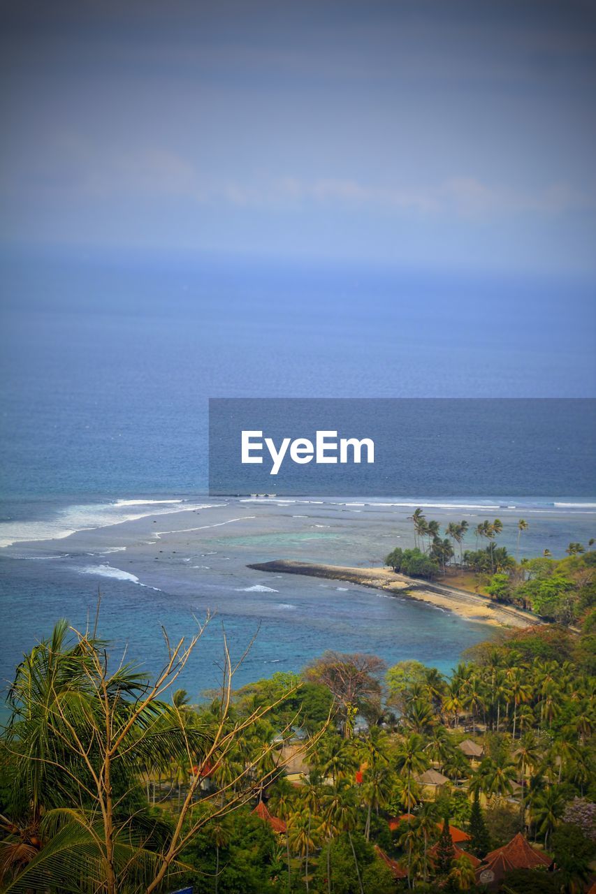 SCENIC VIEW OF BAY AGAINST BLUE SKY