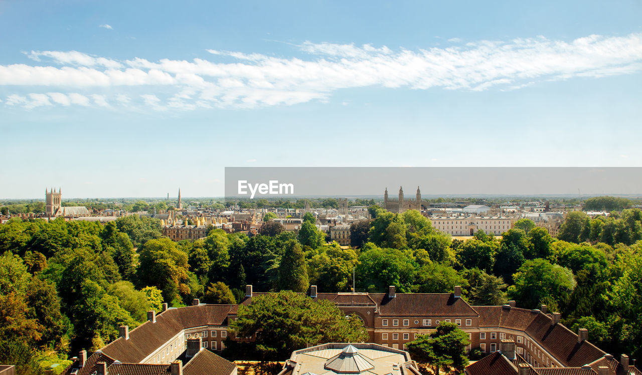 High angle view of trees and buildings against sky