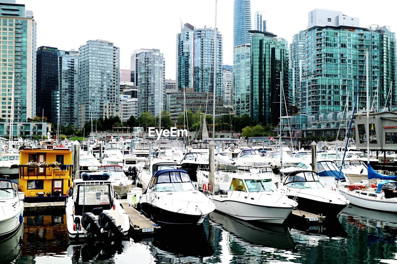 Boats moored at harbor