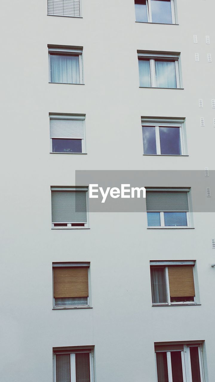 Low angle view of shutter windows on building