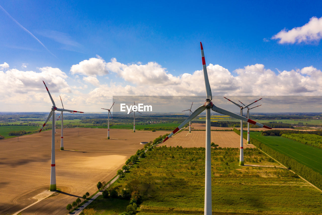Aerial view of wind mills or wind turbines - view of a drone