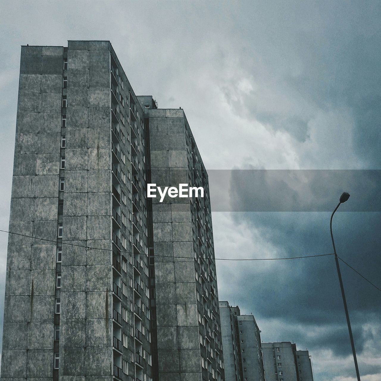 Exterior of buildings against cloudy sky