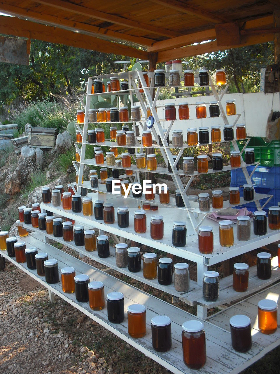 FULL FRAME SHOT OF WINE BOTTLES ON TABLE