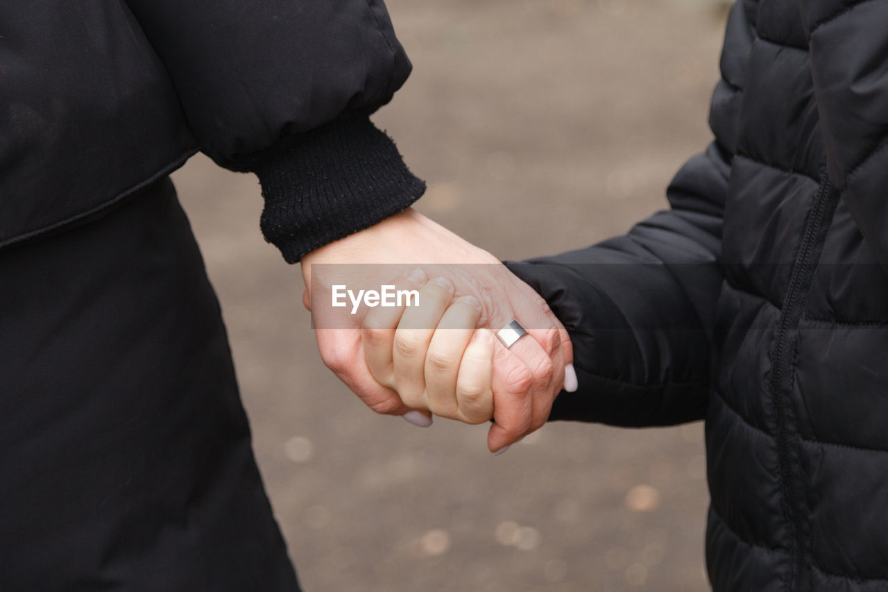 Close-up human hands together 