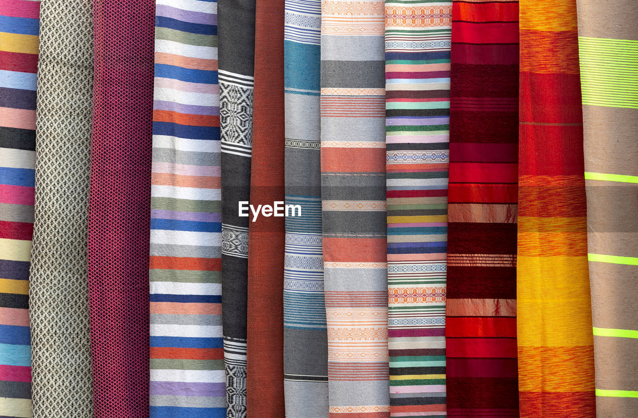 multi colored, full frame, backgrounds, pattern, textile, variation, no people, close-up, interior design, striped, indoors, retail, art, for sale, large group of objects, side by side, yellow, in a row, industry, textured, store