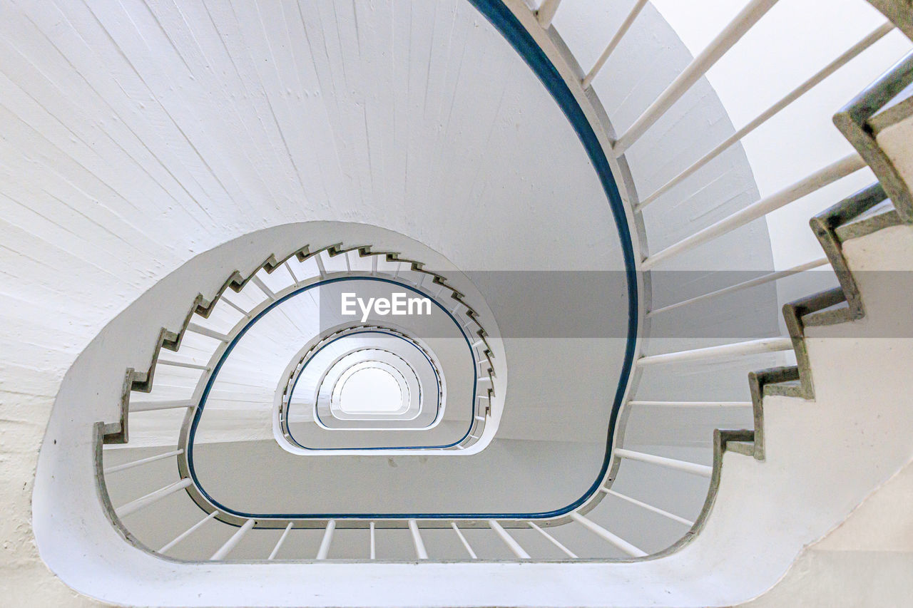 Directly below shot of spiral staircase in building