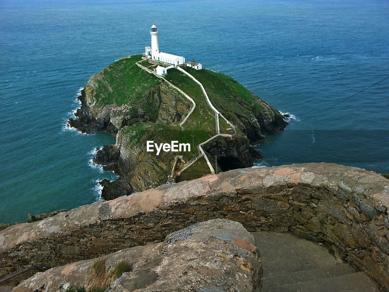 High angle view of south stack lighthouse amidst sea