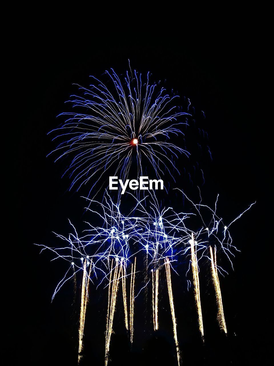 LOW ANGLE VIEW OF FIREWORKS AGAINST SKY