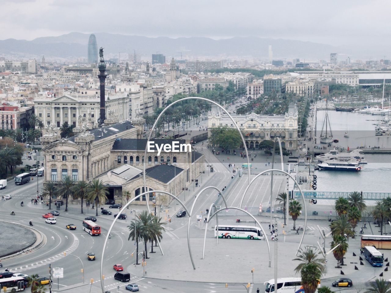 HIGH ANGLE VIEW OF CITYSCAPE AGAINST BRIDGE