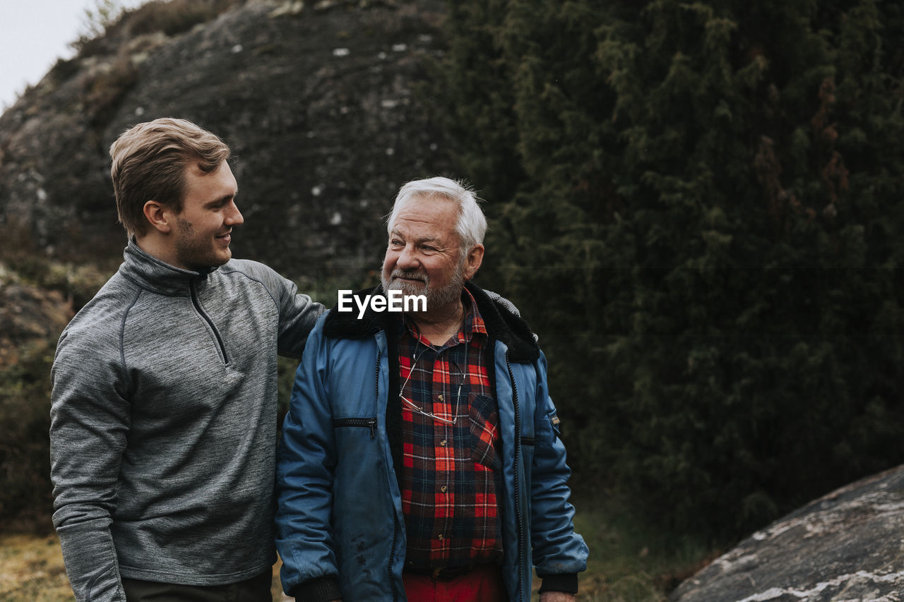 Father with adult son looking at each other